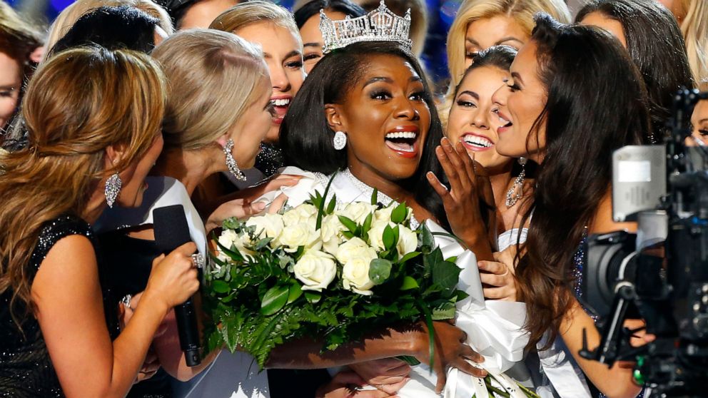 FILE - This Sept. 9, 2018 file photo shows Miss New York Nia Franklin, center, reacting after being named Miss America 2019 in Atlantic City, N.J. The Miss America Organization has denied credentials to cover this year's pageant to several media outl