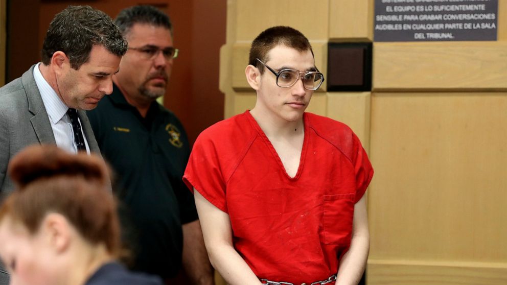 Florida school shooting defendant Nikolas Cruz enters the courtroom for a hearing at the Broward Courthouse, Tuesday, Dec. 10, 2019, in Fort Lauderdale, Fla. Broward Circuit Judge Elizabeth Scherer set a Dec. 19 date for arguments on the motion by de