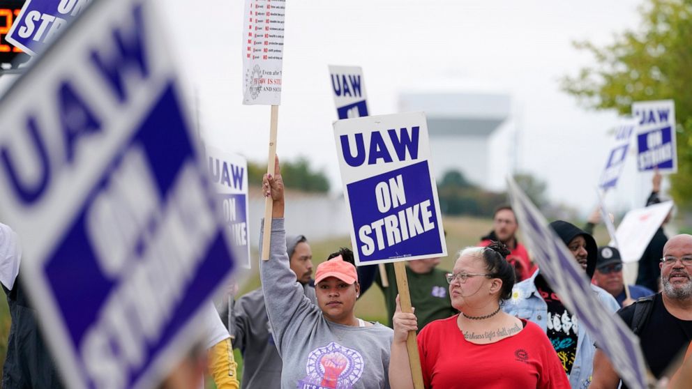 Members of the United Auto Workers strike outside of a John Deere plant, Wednesday, Oct. 20, 2021, in Ankeny, Iowa. About 10,000 UAW workers have gone on strike against John Deere since last Thursday at plants in Iowa, Illinois and Kansas. (AP Photo/