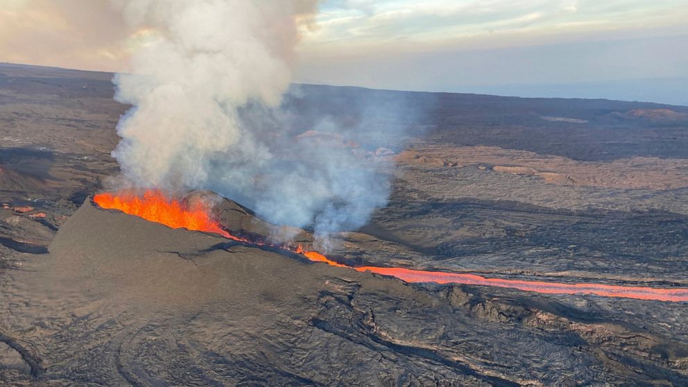 In this aerial image provided by the U.S. Geological Survey, fissure 3 is seen erupting on the Northeast Rift Zone of Mauna Loa on the Big Island of Hawaii, Wednesday, Dec. 7, 2022. The world's largest volcano continues to erupt but scientists say la