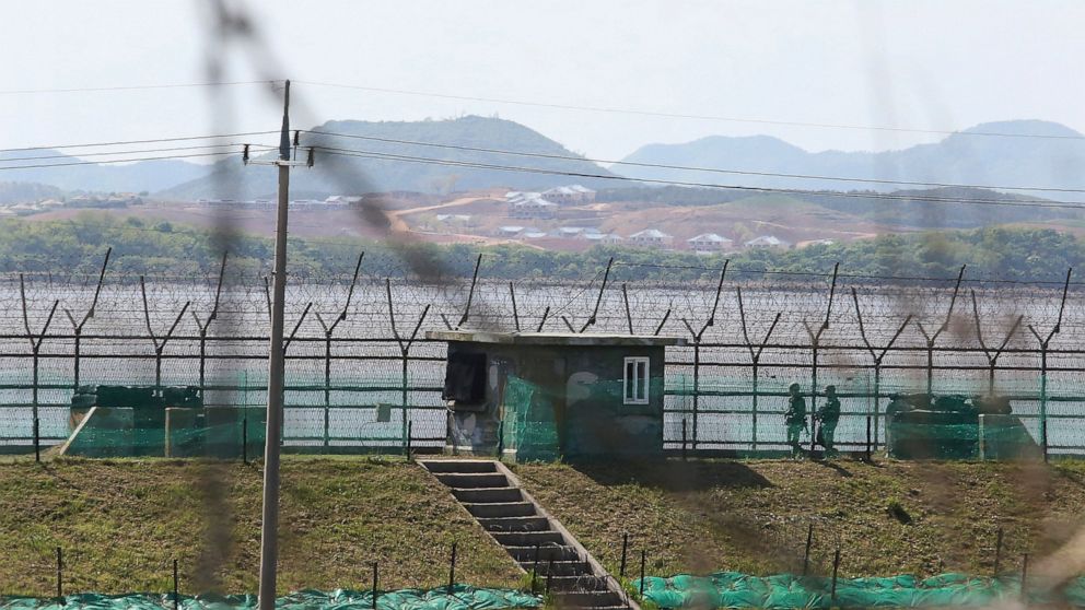 South Korean army soldiers patrol along the barbed-wire fence in Paju, South Korea, near the border with North Korea, Sunday, May 2, 2021. North Korea on Sunday warned the United States will face "a very grave situation" because President Joe Biden "