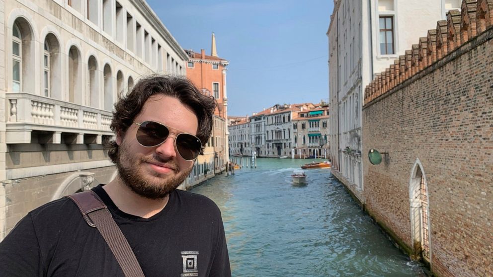 This 2019 photo shows Duncan Lemp in Venice, Italy. Lemp was asleep in his bedroom when police opened fire from outside his house, killing him and wounding his girlfriend, an attorney for the 21-year-old man’s family said Friday, March 13, 2020. (Mer