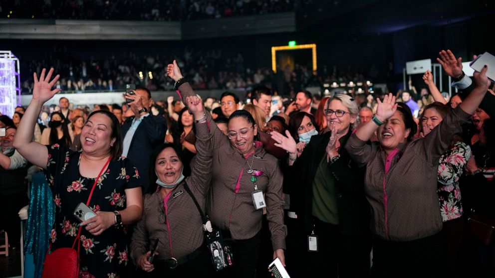 Employees of The Cosmopolitan of Las Vegas celebrate at an event announcing cash bonuses for employees, Wednesday, May 11, 2022, in Las Vegas. Blackstone, the corporate owner of The Cosmopolitan of Las Vegas, surprised employees at an appreciation ev