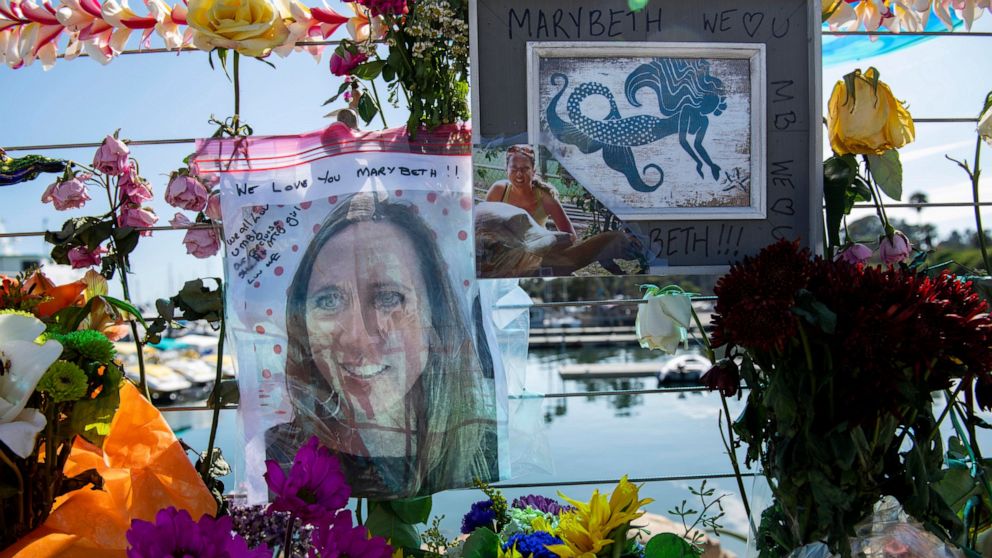 Photographs of loved ones lost in the fire on the scuba boat Conception are placed at a memorial on the Santa Barbara Harbor on Wednesday, Sept. 4, 2019, in Santa Barbara, Calif. A fire raged through the boat carrying recreational scuba divers anchor