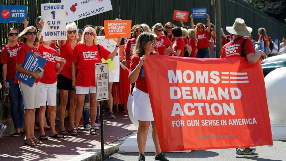 FILE - In this Tuesday, July 9, 2019 file photo, Moms Demanding Action line up during a rally at the State Capitol in Richmond, Va. Governor Northam called a special session of the General Assembly to consider gun legislation in light of the Virginia