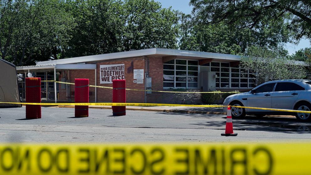 FILE - Crime scene tape surrounds Robb Elementary School after a mass shooting in Uvalde, Texas, May 25, 2022. The Uvalde school shooter gave so many signals that he was violent and unstable that he was nicknamed “school shooter” by teenagers who kne