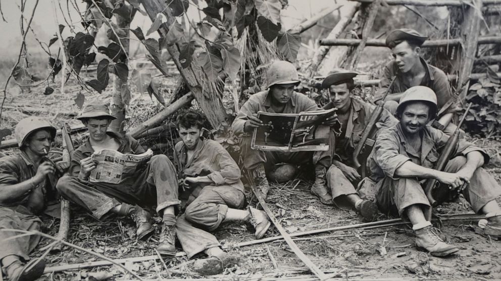 FILE - This Aug. 2, 1944 photo, courtesy of the U.S. Army Signal Corps, shows members of the famed WWII Army unit Merrill's Marauders less than 75 yards from enemy positions, on display during a gathering of remaining members, family and history buff