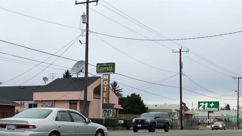 Cars drive by the Emerald Motel in North Seattle on Friday, Nov. 11, 2022. Prosecutors say a 20-year-old woman made a harrowing escape from her vicious pimp outside the motel on the night of Saturday, Nov. 5, before being rescued by a ride-share driv