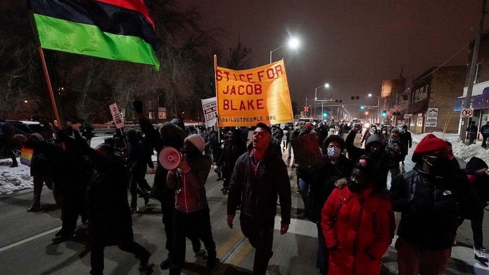 Supporters for Jacob Blake march Monday, Jan. 4, 2021, in Kenosha, Wis. Kenosha Police Officer Rusten Sheskey opened fire on Blake in August after responding to a domestic dispute, leaving him paralyzed. (AP Photo/Morry Gash)