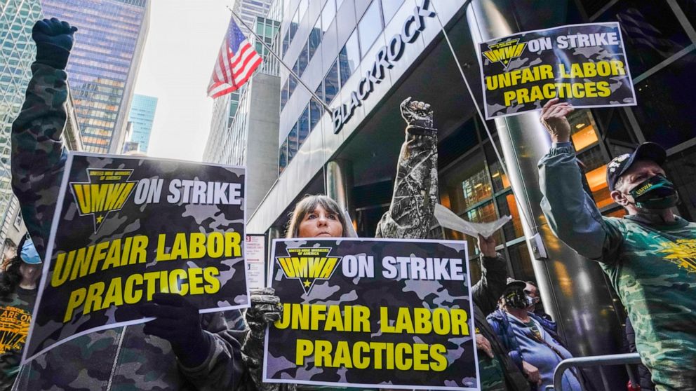 FILE - Members and supporters of the of the United Mine Workers of America demonstrate outside BlackRock headquarters on Nov. 4, 2021, in New York. A federal oversight board ordered the United Mine Workers of America on July 22, 2022, to pay more tha