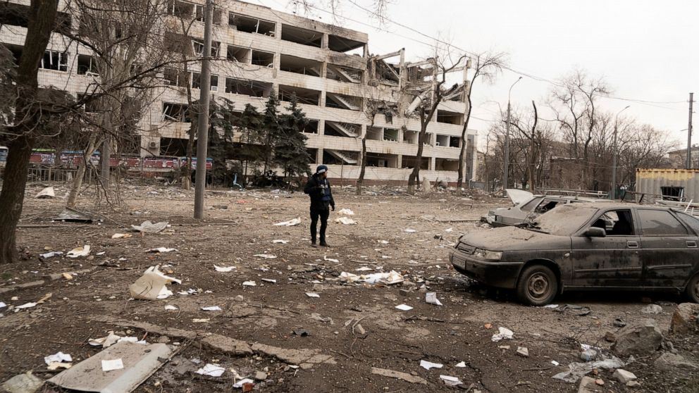 FILE - Associated Press photographer Evgeniy Maloletka stands amid rubble of an airstrike on Pryazovskyi State Technical University on March 10, 2022, in Mariupol, Ukraine. Maloletka and Mstyslav Chernov, two Ukrainians who documented the horrors of 