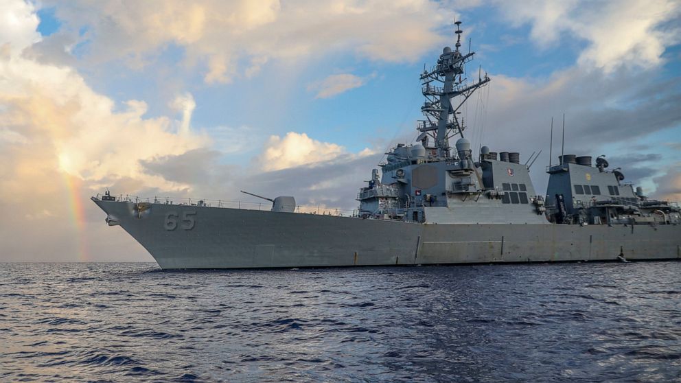 In this photo provided by U.S. Navy, Arleigh Burke-class guided-missile destroyer USS Benfold (DDG 65) conducts routine underway operations in the Philippines Sea on June 24, 2022. The U.S. Navy on Wednesday, July 13, 2022, sailed the destroyer close