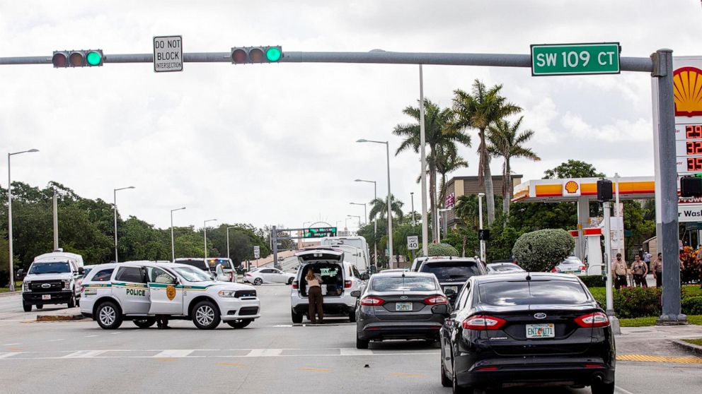 Police block an intersection near the Miami-Dade Kendall Campus in Miami, Fla., on Sunday, June 6, 2021. Three people are dead and at least six others injured following a shooting at a Florida graduation party, the latest in a string of such violence