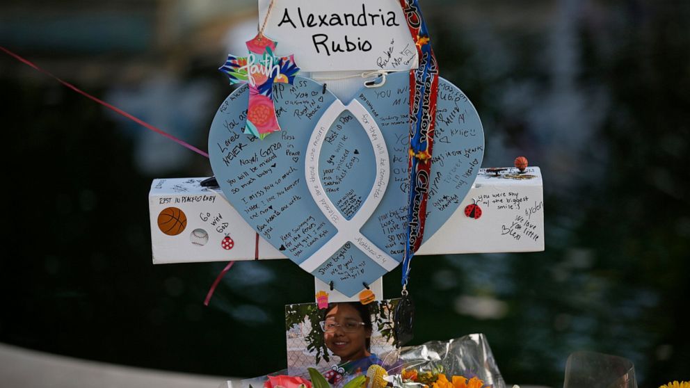 Alexandria Rubio's cross stands at a memorial site for the victims killed in this week's shooting at Robb Elementary School in Uvalde, Texas, Friday, May 27, 2022. (AP Photo/Dario Lopez-Mills)