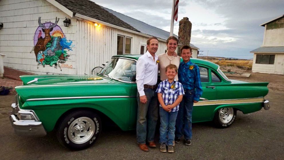 This recent photo provided by Jasmine Tool shows herself with her fiance Daniel Jastrab and their sons Jameson, right, and Silas. Tool, an ailing U.S. Fish and Wildlife Service worker in Oregon, says she can’t learn why her federally paid insurance l