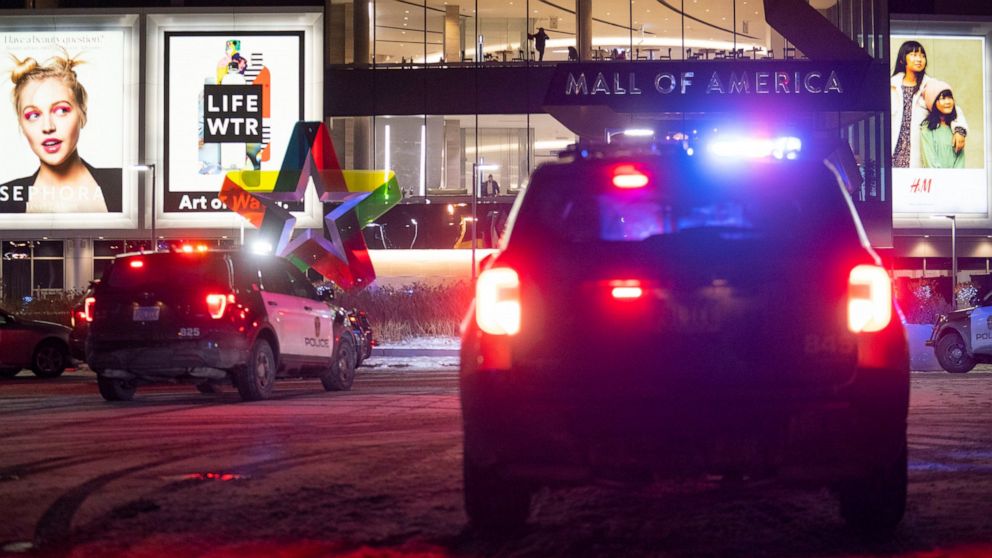 Bloomington Police vehicles are parked outside of the Mall of America following a shooting, Friday, Dec. 31, 2021, in Bloomington, Minn. Two people were shot and wounded following an apparent altercation at the Mall of America Friday, sending New Yea