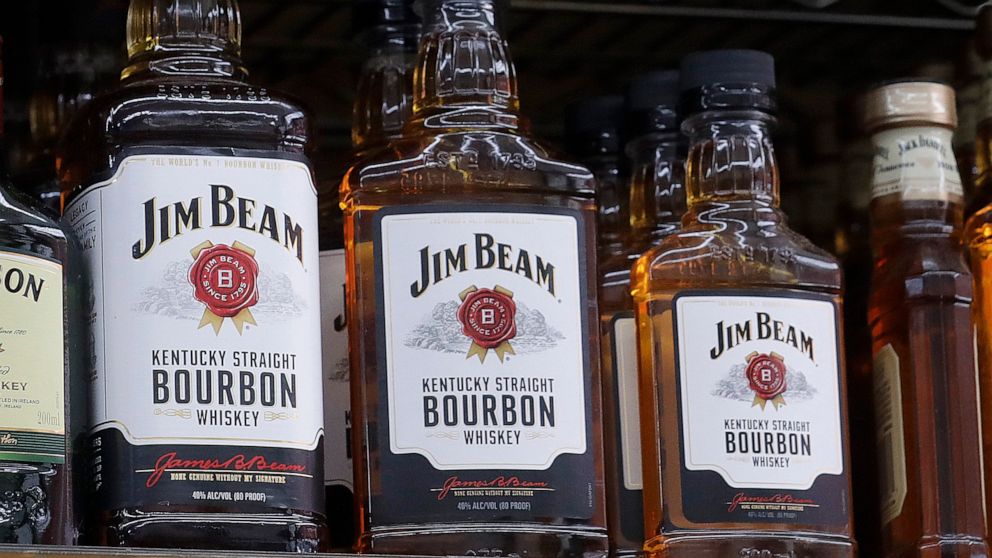 FILE - Jim Beam bottles are displayed at Rossi's Deli in San Francisco, July 9, 2018. Jim Beam plans to ramp up bourbon production at its largest Kentucky distillery to meet growing global demand in a more than $400 million expansion to be powered by