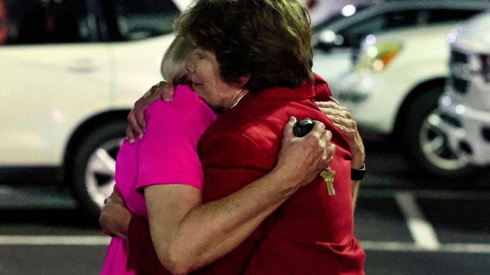 Church members console each other after a shooting at the Saint Stevens Episcopal Church on Thursday, June 16, 2022 in Vestavia, Ala. (AP Photo/Butch Dill)
