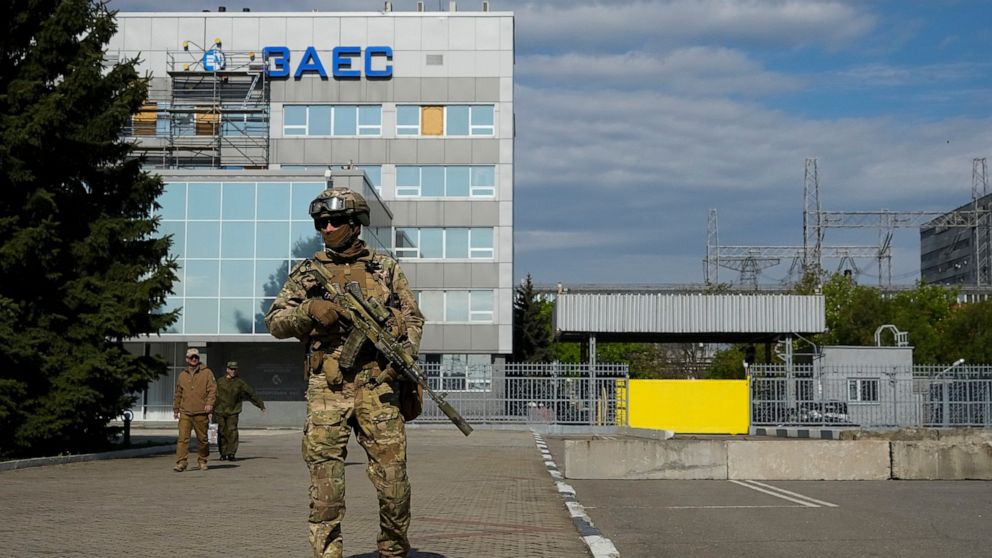 FILE - A Russian serviceman stands guard in an area of the Zaporizhzhia Nuclear Power Station in territory under Russian military control, southeastern Ukraine, on May 1, 2022. The Zaporizhzhia plant is in southern Ukraine, near the town of Enerhodar