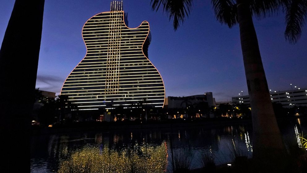 FILE- In this Jan. 19, 2021, file pot, The Guitar Hotel at Seminole Hard Rock Hotel & Casino Hollywood is illuminated at night in Hollywood, Fla. Florida Gov. Ron DeSantis reached an agreement with the state's Seminole Tribe on Friday, April 23, 2021