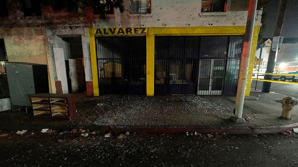 Local business are seen damaged after illegal fireworks seized at a South Los Angeles home exploded, in South Los Angeles Wednesday evening, June 30, 2021. A cache of homemade fireworks exploded as it was being destroyed by a bomb squad, flipping and