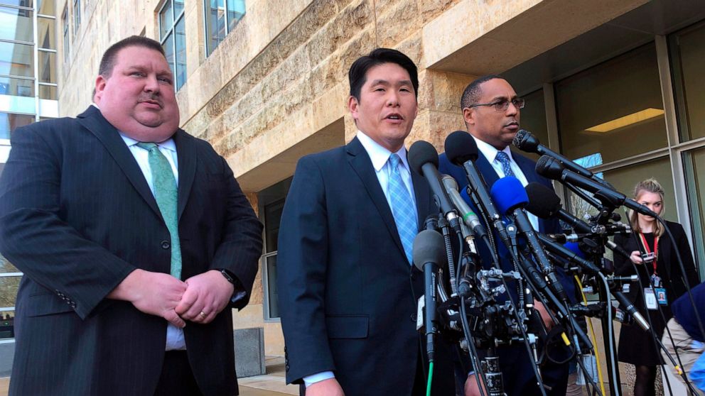 FILE - This Feb. 21, 2019, file photo shows U.S. Attorney Robert Hur, center, of the District of Maryland, speaks as Art Walker, left, special agent from the Coast Guard investigative service, and Gordon Johnson, special agent in charge of the FBI's 