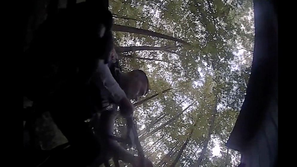 This screengrab of body camera footage provided by the Raleigh, N.C., Police Department shows a shootout that nonfatally struck one officer. On Thursday, Dec. 1, 2022, seven weeks after a 15-year-old boy fatally shot five people and injured two in an