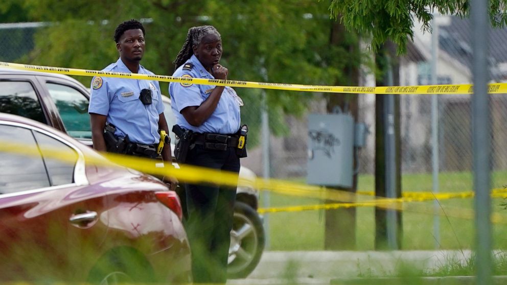 Investigators search the crime scene of a shooting at Xavier University in New Orleans, Tuesday, May 31, 2022. (AP Photo/Gerald Herbert)