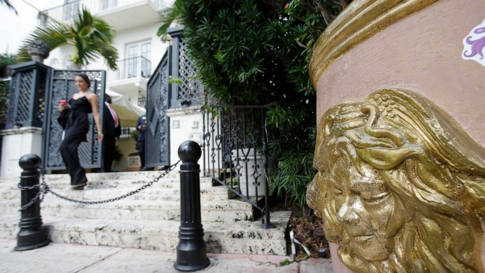 FILE - In this Sept. 17, 2013, file photo, the Versace logo is shown on a planter outside of the South Beach mansion that once belonged to Gianni Versace in Miami Beach, Fla. Two men apparently killed themselves, police said, Thursday, July 15, 2021,