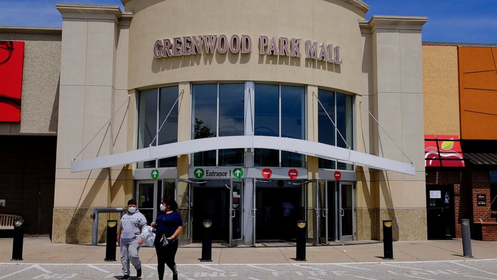 FILE - Shoppers leave the Greenwood Park Mall on May 4, 2020, in Greenwood, Ind. Indianapolis Metropolitan Police say two people were killed in a shooting Sunday, July 17, 2022, at the mall in Greenwood and multiple other people were taken to hospita