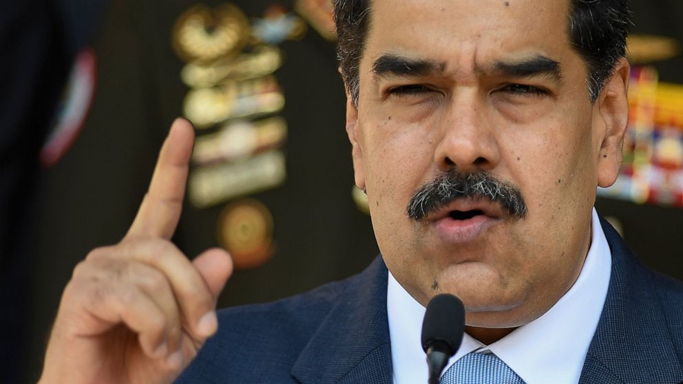 FILE - In this March 12, 2020 file photo, Venezuelan President Nicolas Maduro gives a press conference at Miraflores presidential palace in Caracas, Venezuela. Independent experts commissioned by the U.N.’s top human rights body have issued a scathin