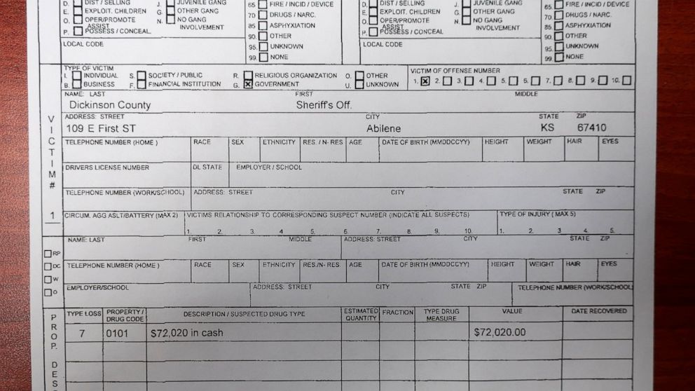 This Friday, April 23, 2021 photo shows the bottom part of a report filed by a Kansas Bureau of Investigation agent on Oct. 10, 2018, about $72,020 in cash missing from the custody of the Dickinson County Sheriff's Department sometime after a January