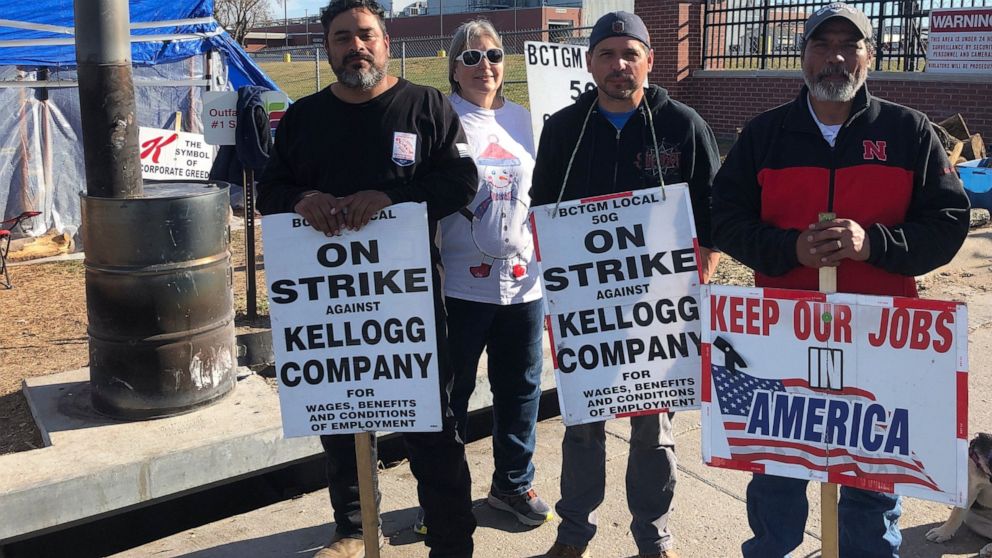 Omaha Striking Kellogg's workers Michael Rodarte, Sue Griffin, Michael Elliott and Mark Gonzalez stand outside the Omaha, Neb., cereal plant Thursday, Dec. 2, 2021. The company and the union announced Thursday that they have reached a tentative contr