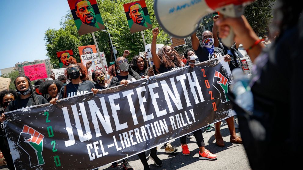 Protesters chant as they march after a Juneteenth rally at the Brooklyn Museum, Friday, June 19, 2020, in the Brooklyn borough of New York. Juneteenth commemorates when the last enslaved African Americans learned they were free 155 years ago. Now, wi