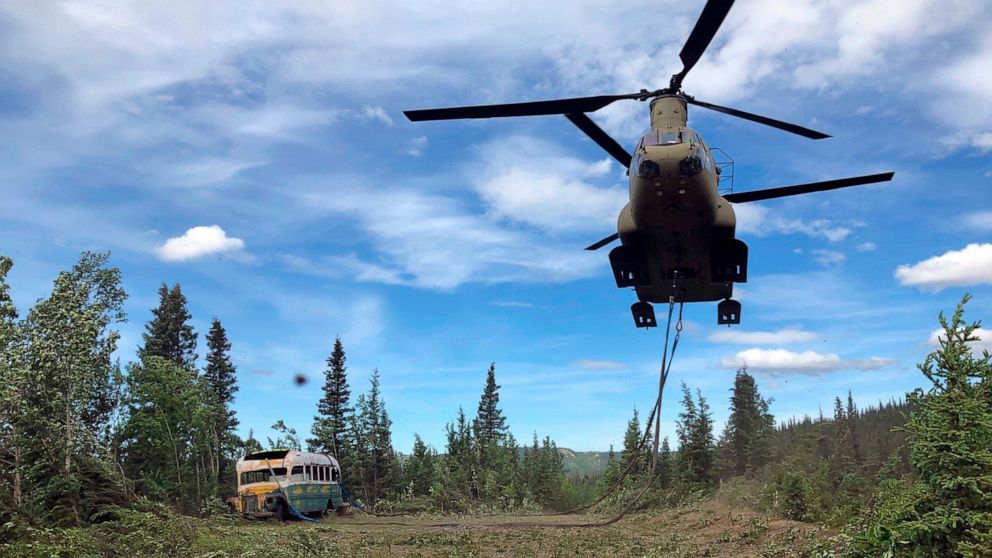 In this photo released by the Alaska National Guard, Alaska Army National Guard soldiers use a CH-47 Chinook helicopter to removed an abandoned bus, popularized by the book and movie "Into the Wild," out of its location in the Alaska backcountry Thur