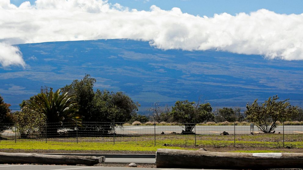 Mauna Loa is seen from the Gilbert Kahele Recreation Area off Saddle Road on the Big Island of Hawaii on Oct. 27, 2022. The ground is shaking and swelling at Mauna Loa, the largest active volcano in the world, indicating that it could erupt. Scientis