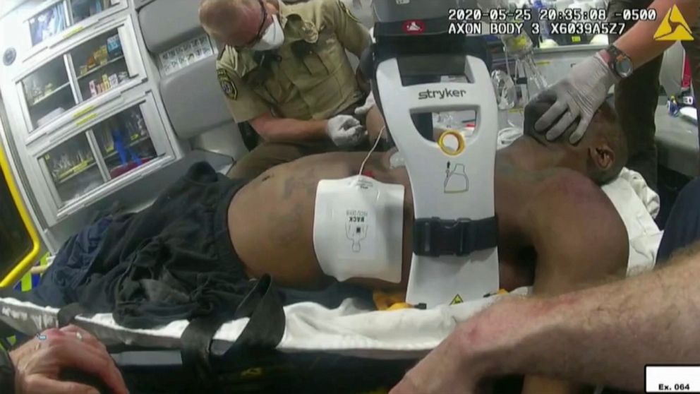 FILE - This image from police body camera video shows emergency personal tending to George Floyd after he had been loaded into an ambulance on May 25, 2020, in Minneapolis. A paramedic who treated Floyd on the day he was killed testified Wednesday, J