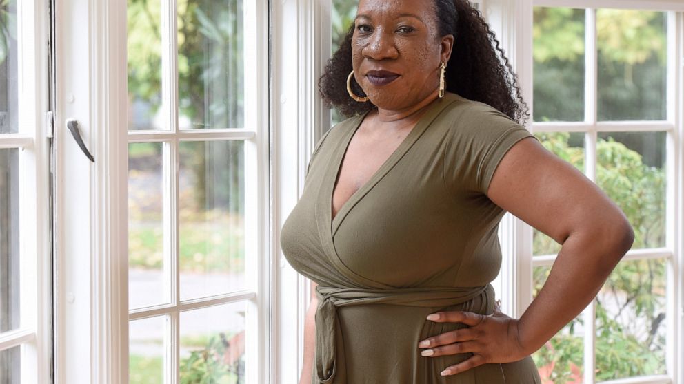 Tarana Burke, founder and leader of the #MeToo movement, stands in her home in Baltimore on Oct. 13, 2020. Black women and girls are now the focus of several high-profile philanthropic initiatives as major donors look to address the racial wealth gap
