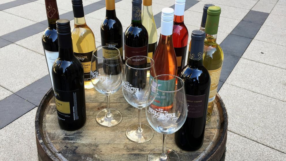 FILE - In the March 28, 2017, file photo, wines from the Next Chapter Winery, of New Prague, Minn., and Alexis Bailly Vineyard, of Hastings, Minn., are displayed at a news conference outside the federal courthouse in Minneapolis. A federal judge stru