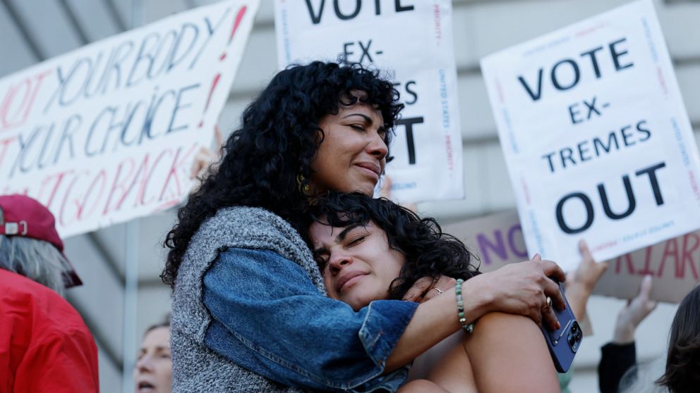 Mitzi Rivas, left, hugs her daughter Maya Iribarren during an abortion-rights protest at City Hall in San Francisco following the Supreme Court's decision to overturn Roe v. Wade, Friday, June 24, 2022. The U.S. Supreme Court's decision to end consti