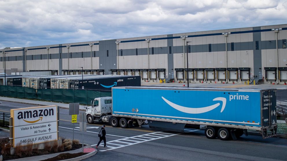 FILE - A truck arrives at the Amazon warehouse facility on the Staten Island borough of New York, April 1, 2022. Amazon is barring off-duty warehouse workers from the company’s facilities, a move organizers say can hamper union drives. (AP Photo/Edua