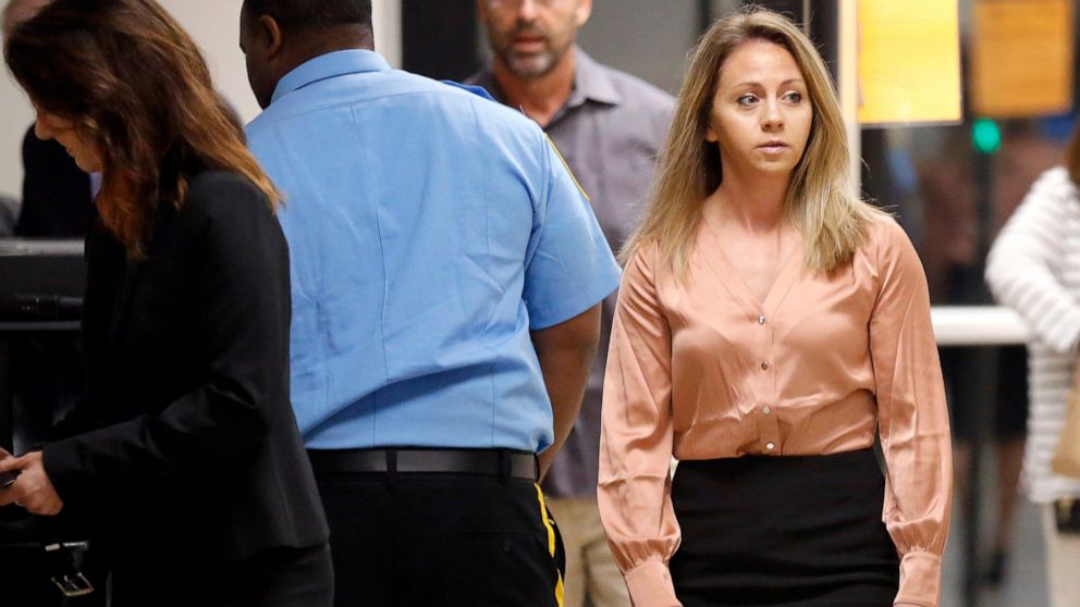 FILE - In this Sept. 13, 2019 file photo, fired Dallas police Officer Amber Guyger, right, arrives for jury selection in her murder trial at the Frank Crowley Courthouse in downtown Dallas. The murder trial for a Guyger who shot and killed Botham Jea