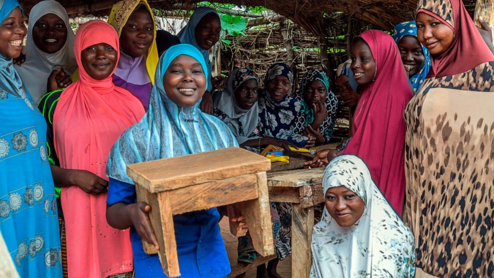 This Aug. 2021 image provided by VOW for Girls shows a group of girls participating in a carpentry workshop run by one of VOW's grantees in Central Niger. The program is one example of job training provided to girls to help them avoid becoming child 