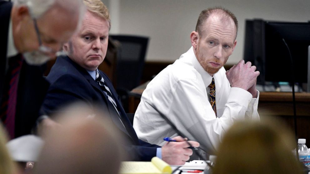 FILE - Chad Isaak, right, of Washburn, sits with his defense team during the third day of his murder trial at the Morton County Courthouse in Mandan, N.D., on Wednesday, Aug. 4, 2021. Authorities say Isaak, convicted in a 2019 quadruple slaying, has 