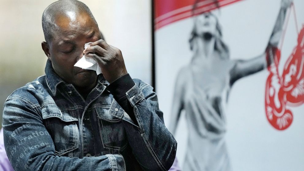 Peter Lyoya wipes his eyes after looking at video of his son's shooting during a news conference, Wednesday, Dec. 7, 2022, in Detroit. The family of Patrick Lyoya, a Black motorist fatally shot by a white police officer in Grand Rapids, Mich., filed 