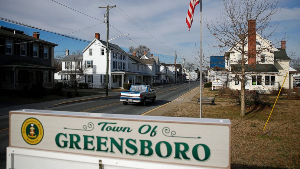 In this Jan. 28, 2019, photo, a motorist drives past a welcome sign in Greensboro, Md. A black teenager's death in police custody has roiled this rural town on Maryland's Eastern Shore and left a grief-stricken family yearning for answers to their li