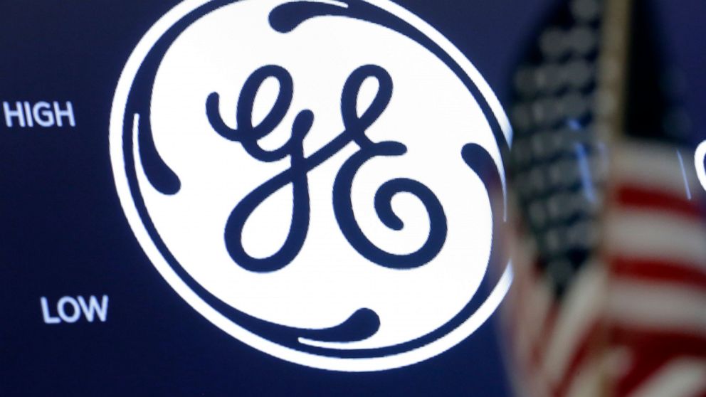 FILE - In this June 26, 2018, file photo the General Electric logo appears above a trading post on the floor of the New York Stock Exchange. GE Appliances announced plans Thursday, Oct. 28, 2021, to add more than 1,000 jobs at its sprawling Kentucky 