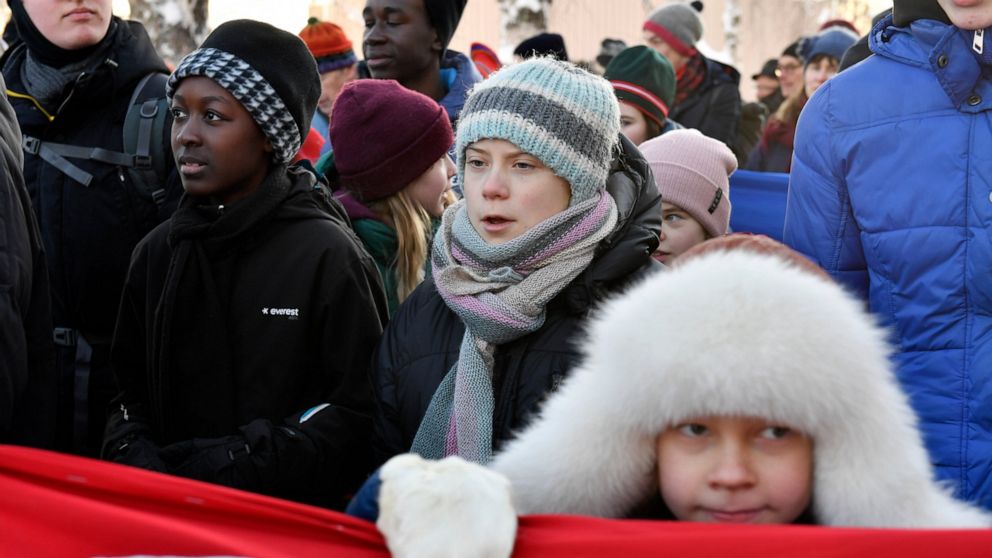 FILE - Swedish climate activist Greta Thunberg, center, takes part in a climate strike with Sami children in Jokkmokk, Sweden, Feb. 7, 2020. Two independent U.N. human rights experts called Thursday Feb. 10, 2022, on Sweden’s government not to issue 