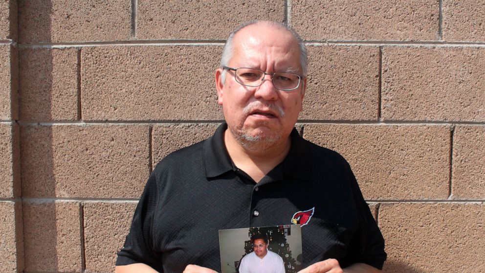 Auska Mitchell holds a photograph of his nephew, Lezmond Mitchell, on Friday, Aug. 21, 2020 in Goodyear, Ariz. Lezmond Mitchell is scheduled to be executed Wednesday, Aug. 26, and the Navajo government is pushing to spare his life on the basis of cul