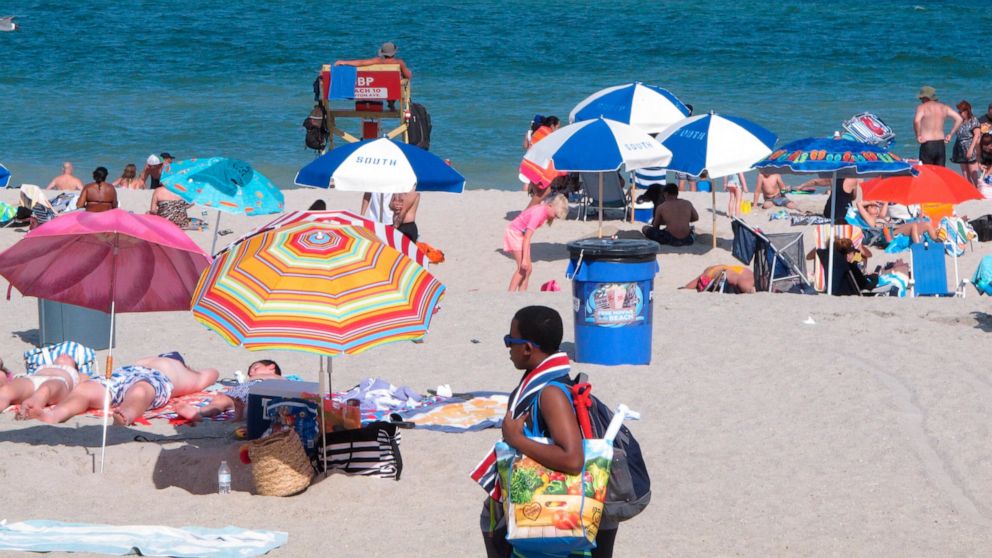Beachgoers enjoy a sunny day on the beach in Point Pleasant Beach, N.J. on July 15, 2019. Point Pleasant Beach's mayor said on June 10, 2022, that it would join Long Branch, N.J., in seeking court orders to prevent so-called "pop-up parties" on its b